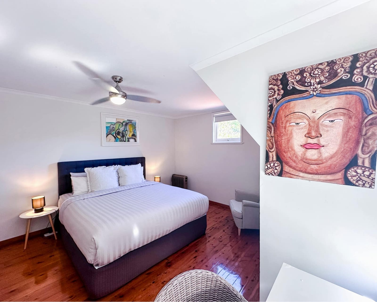 Marguerita Room, bed with a white headboard and a window