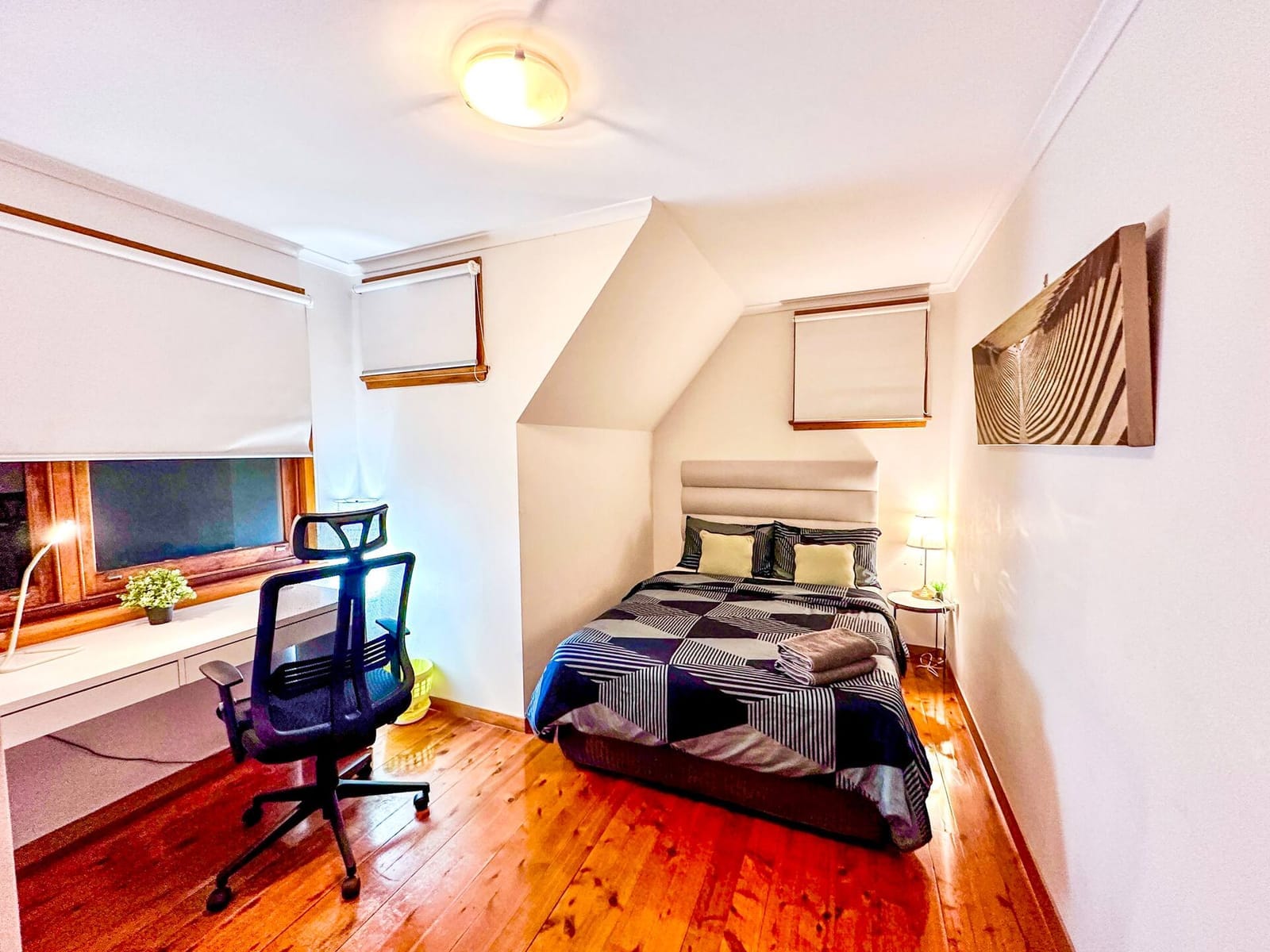 Small Room, bed with a window and a wooden wardrobe